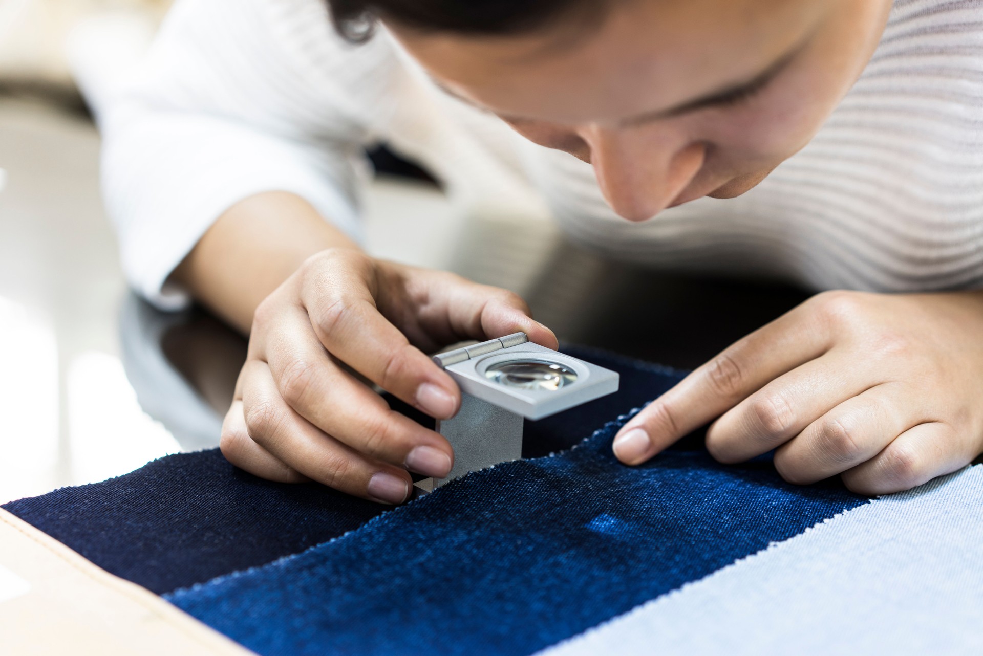 Woman examining fabric quality